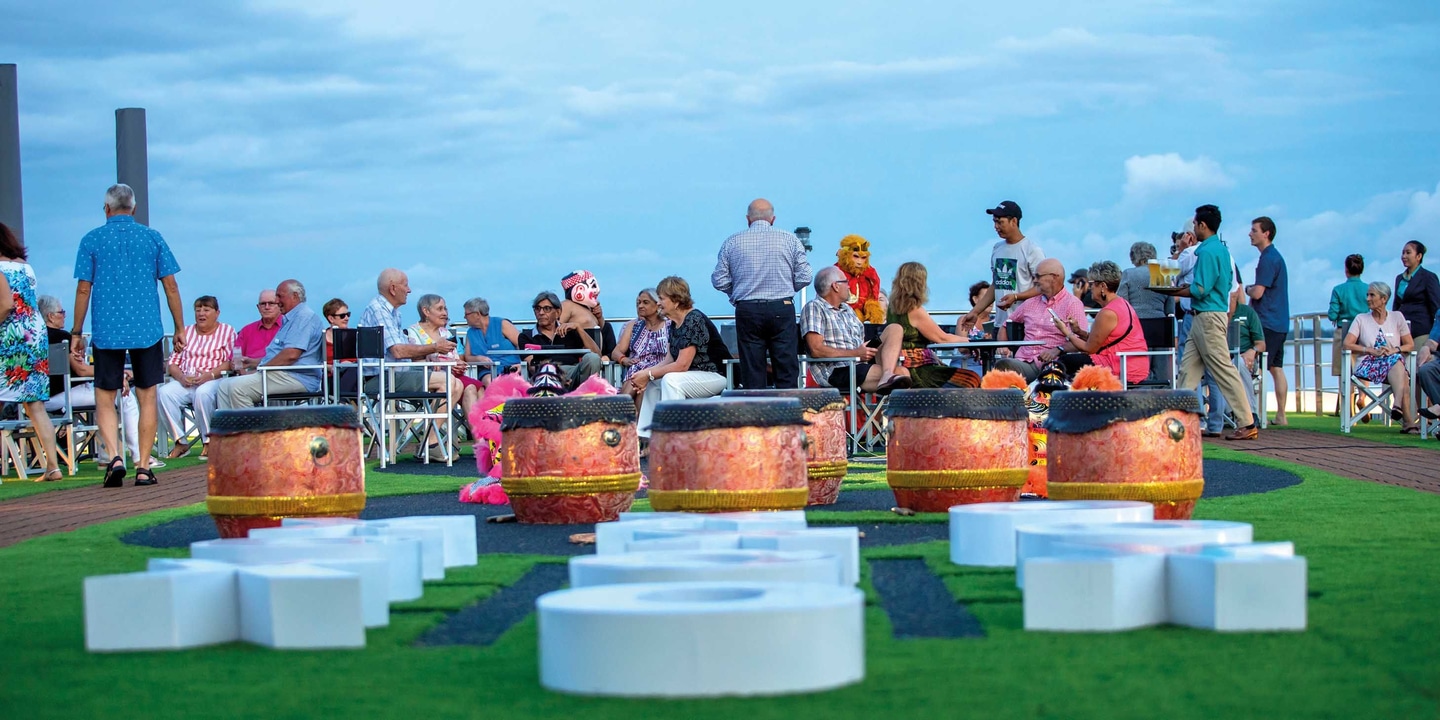 Group of people on the top deck of a river cruise
