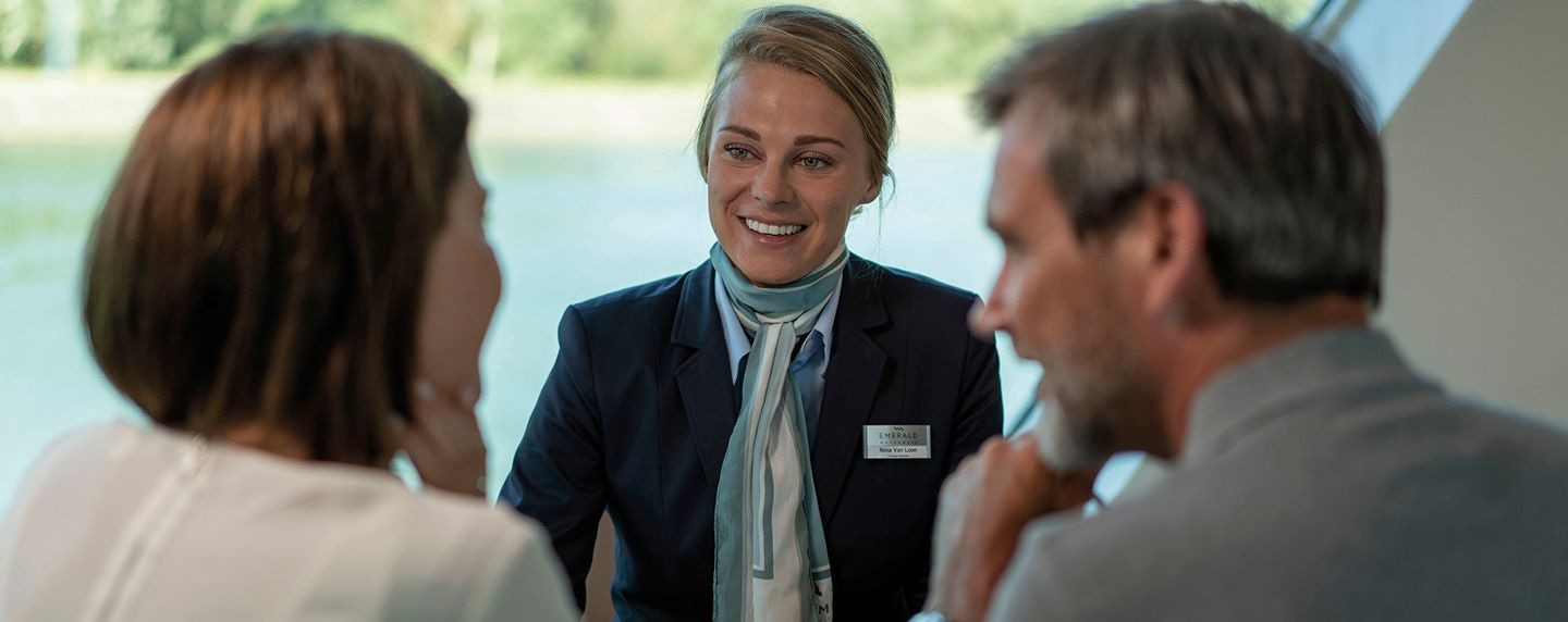 Emerald cruise director with two guests