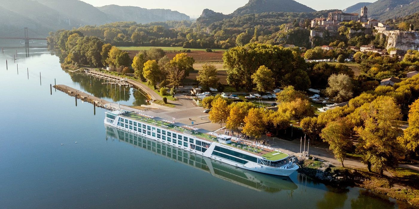 Emerald Cruises river ship docked beside a French riverside village